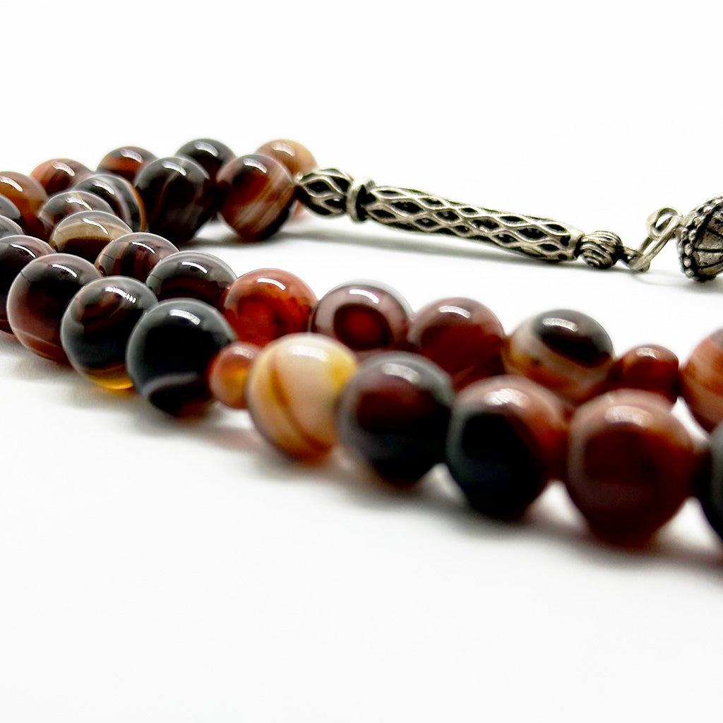 999 حجر عقيق سليماني عيون احمر  10 ملي 33 حبايه دلايه فضه