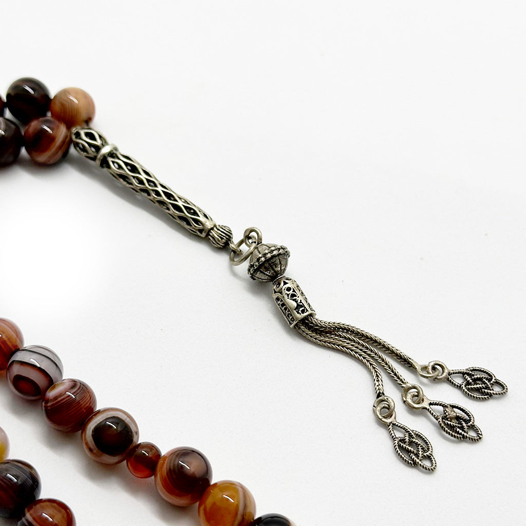 999 حجر عقيق سليماني عيون احمر  10 ملي 33 حبايه دلايه فضه